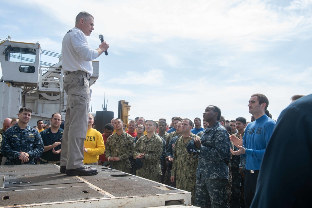 Cmdr. Pavao Huldisch, head of the Nimitz-class aircraft carrier USS John C. Stennis’ (CVN 74) Air department, addresses Sailors on the flight deck during Air department quarters.