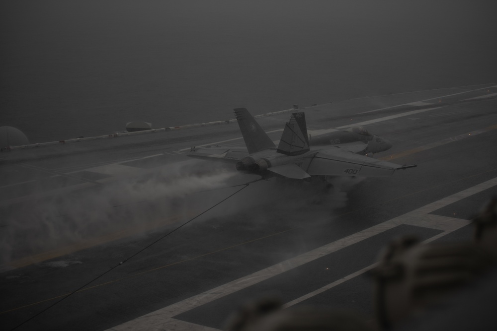 An F/A-18E Super Hornet, with Strike Fighter Squadron (VFA) 151, lands on the flight deck aboard USS John C. Stennis (CVN 74).