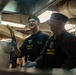 Rear Adm. Michael Wettlaufer, commander, Carrier Strike Group (CSG) 3, serves Thanksgiving dinner in the forward galley aboard USS John C. Stennis (CVN 74).