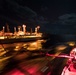 Sailors monitor a refueling station aboard USS Chung-Hoon (DDG 93), right, during a replenishment-at-sea.