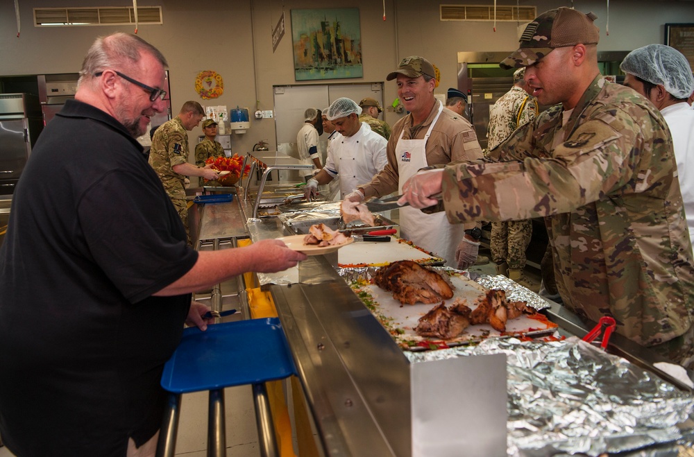 AFCENT leaders serve Thanksgiving meals to service members