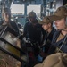 Sailors aboard USS Mobile Bay (CG 53) maneuver the ship from the pilot house during a replenishment-at-sea.