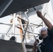 Seaman Emanule Martinez conducts preservation on the main deck of USS Chung-Hoon (DDG 93).