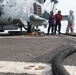 Sailors monitor a fuel line while refueling an MH-60R Sea Hawk, with Helicopter Maritime Strike Squadron (HSM) 37, aboard USS Chung-Hoon (DDG 93).