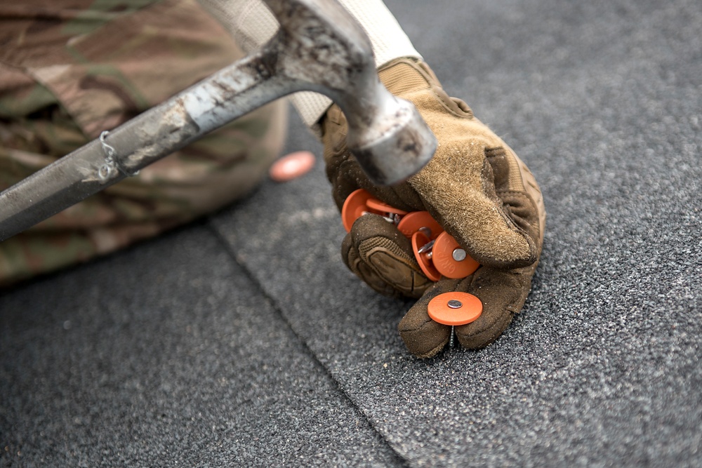 TF Phoenix Airmen repair building roofs