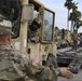 Soldiers load equipment onto trailer