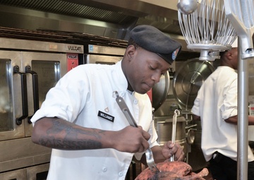 Culinary Specialists from “America’s First Corps” cook all-night long to feed hundreds of Soldiers