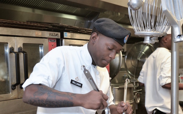 Culinary Specialists from “America’s First Corps” cook all-night long to feed hundreds of Soldiers
