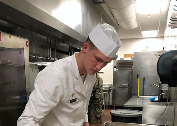 Culinary Specialists from “America’s First Corps” cook all-night long to feed hundreds of Soldiers