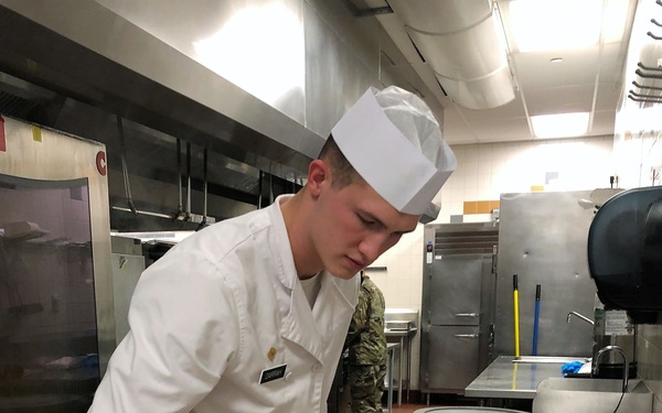 Culinary Specialists from “America’s First Corps” cook all-night long to feed hundreds of Soldiers