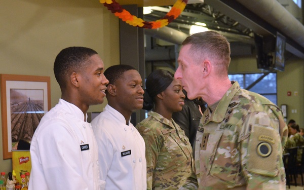Culinary Specialists from “America’s First Corps” cook all-night long to feed hundreds of Soldiers