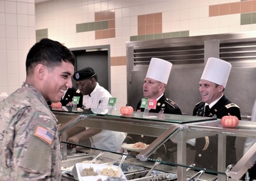 Culinary Specialists from “America’s First Corps” cook all-night long to feed hundreds of Soldiers