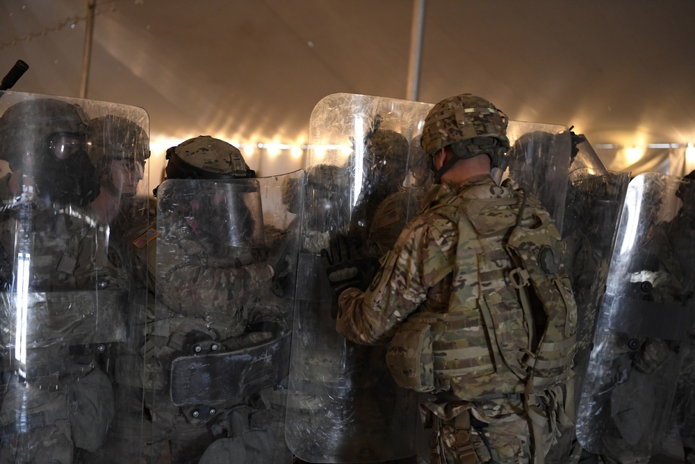 U.S. Army Military Police perform training with riot shields