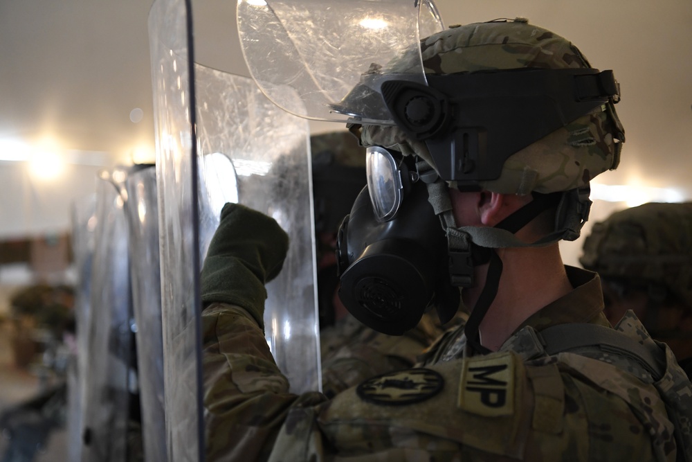 U.S. Army Military Police perform training with riot shields