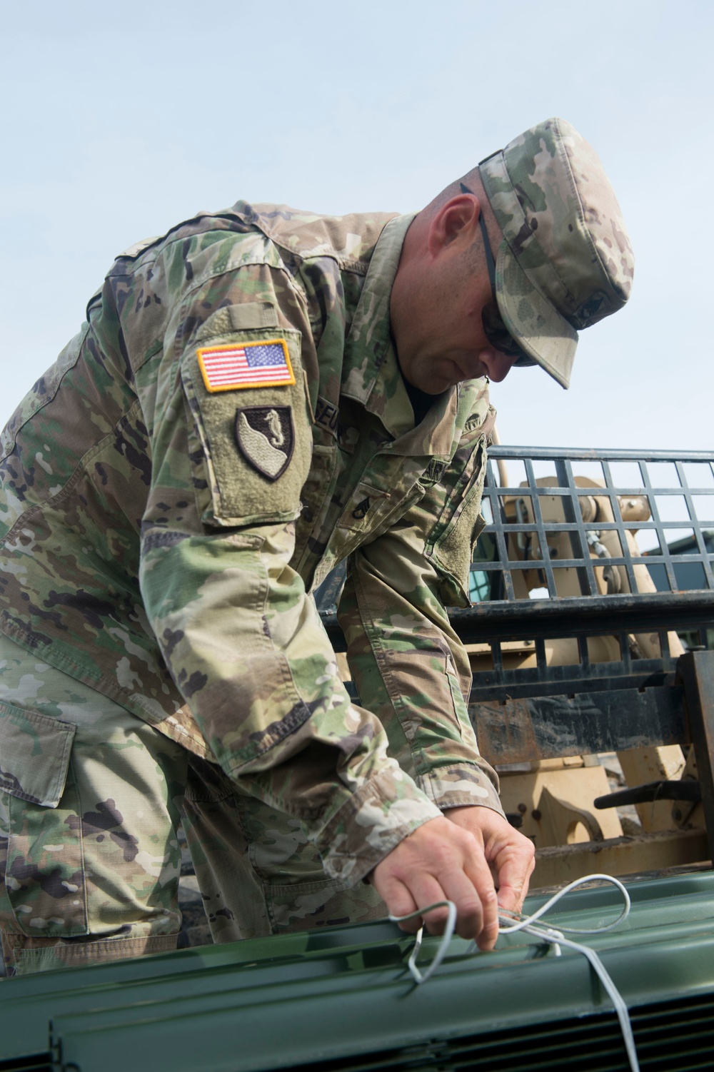 Engineer Soldier Secures Fence Posts