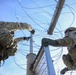 Soldiers Lay Concertina Wire Along Veterans International Bridge