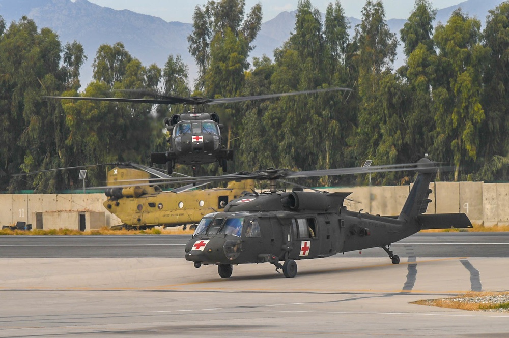 Helicopter near and on flight line