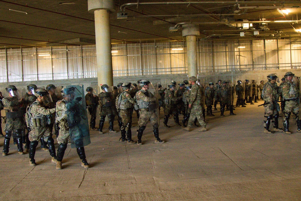 U.S. Soldiers and Marines Practice Non-Lethal Crowd Control Drills