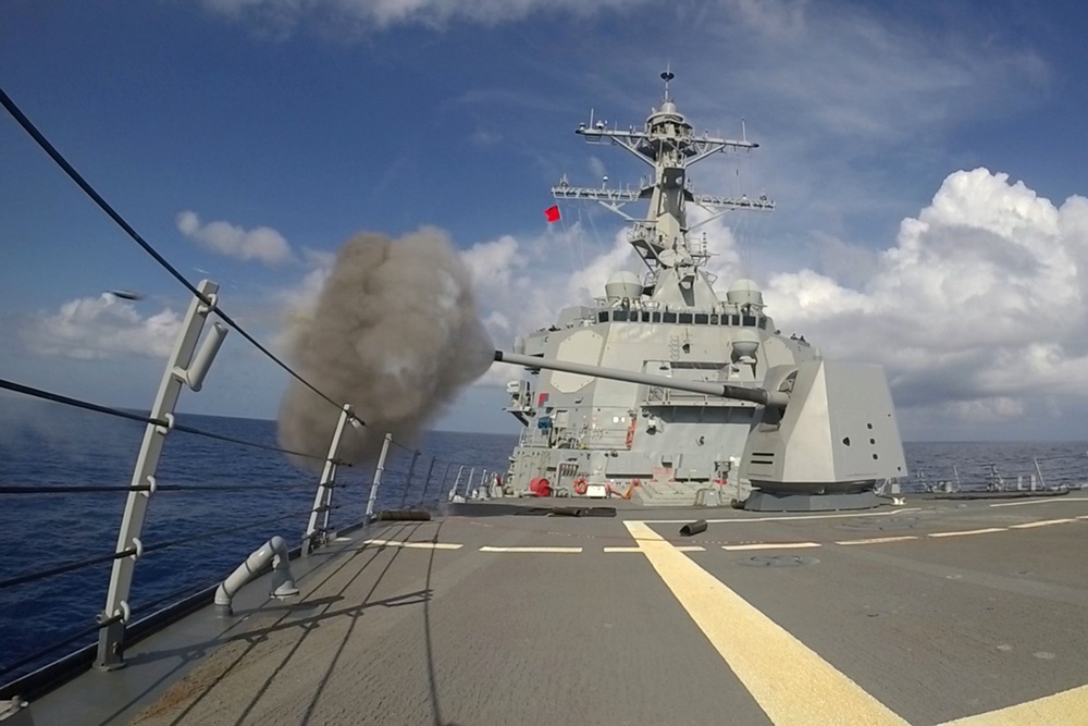 USS Spruance (DDG 111) fires its MK45 5-inch gun during a live fire evolution.