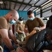 Carrier Strike Group (CSG) 3 Sailors sort donated toys, clothes, and electronics at the Tanglin Salvation Army donation center in Singapore during a community outreach event.