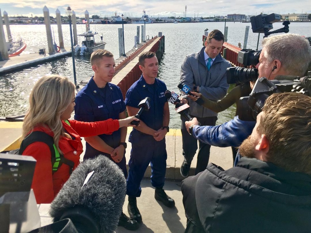 Coast Guard members conduct on-camera interview with media after plane crash rescue in St. Petersburg, FL