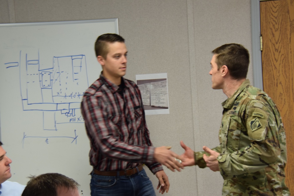 Buffalo District Commander rewards Carl Falkowsky, Safety and Occupational Health Specialist, with Commander's Coin