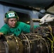 Aviation Machinist’s Mate 3rd Class Ruben Lopez, from Pasadena, Texas, removes an engine from an MH-60S Knight Hawk, with Helicopter Sea Combat Squadron (HSC) 14, in the hangar bay aboard the Nimitz-class aircraft carrier USS John C. Stennis (CVN 74).