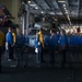 Sailors transit the hangar bay aboard the Nimitz-class aircraft carrier USS John C. Stennis (CVN 74).