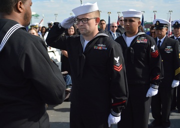 IT2 Alan Hickman Salutes the Ensign at NOSC L.A. CMC Jeffery D. Persiani's Retirement Ceremony