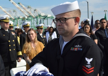 IT2 Alan Hickman Holds the Ensign at NOSC L.A. CMC Jeffery D. Persiani's Retirement Ceremony