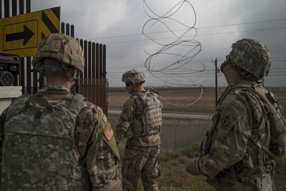 Army Engineers in Cherry Picker Installing C-Wire