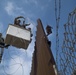 Army Engineers in Cherry Picker Installing C-Wire