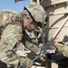 A Soldier Drains a Fuel Drum into a Fuel Tank