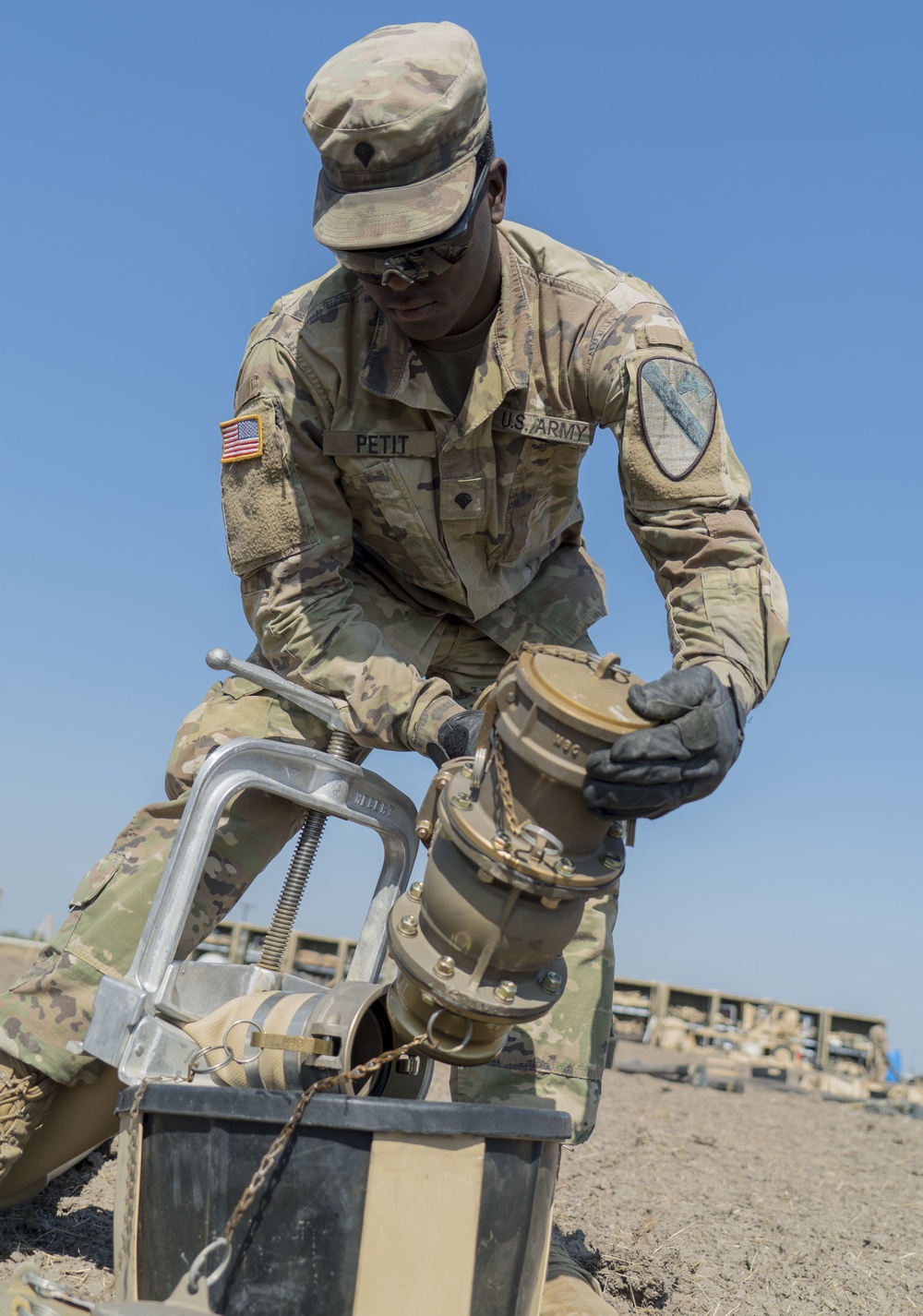 A Soldier Caps a Fuel Line