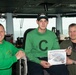 Aviation Boatswain’s Mate (Equipment) 3rd Class Matthew Conner poses for a photograph as the Sailor of the Day with Commanding Officer Capt. Randy Peck and Command Master Chief Benjamin Rushing aboard USS John C. Stennis (CVN 74).