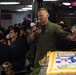 Capt. Randy Peck, commanding officer of USS John C. Stennis (CVN 74), addresses the ship's crew during a Navy birthday celebration on the mess decks.