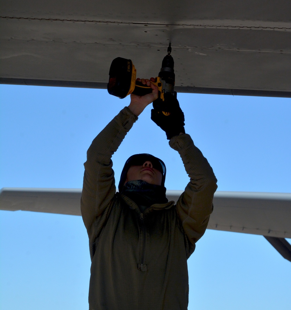 Maintenance and operations ready a KC-135 Stratotanker for flight