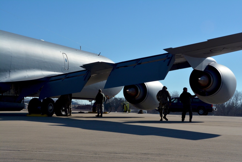 Maintenance and operations ready a KC-135 Stratotanker for flight