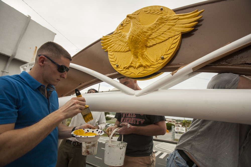 Marines paint friendship archway at Kin Town