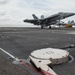 An F/A-18E Super Hornet, with Strike Fighter Squadron (VFA) 14, catches an arresting gear wire as it lands on the flight deck aboard the Nimitz-class aircraft carrier USS John C. Stennis (CVN 74).