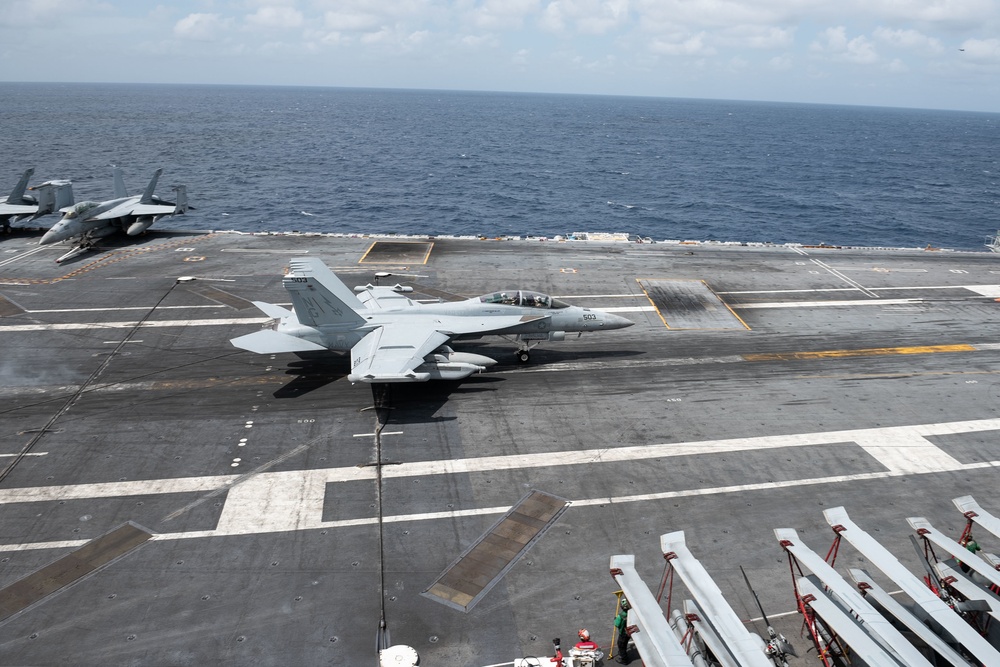 An F/A-18E Super Hornet, with Strike Fighter Squadron (VFA) 14, lands on the flight deck aboard the Nimitz-class aircraft carrier USS John C. Stennis (CVN 74).