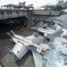 Sailors direct F/A-18E Super Hornets, with Strike Fighter Squadron (VFA) 14, onto an aircraft elevator aboard the Nimitz-class aircraft carrier USS John C. Stennis (CVN 74).