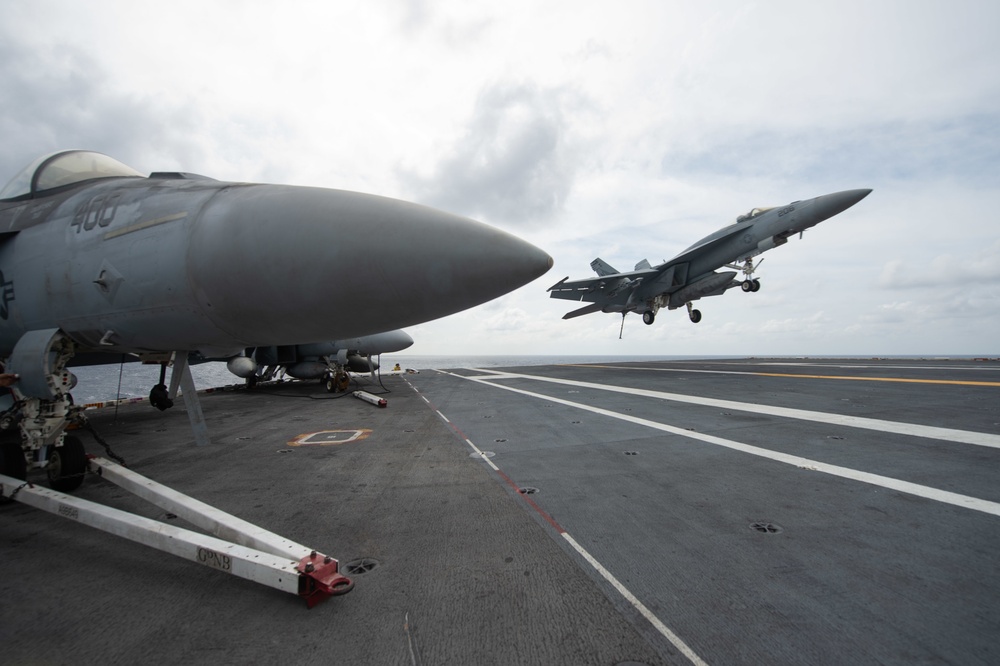 An F/A-18E Super Hornet, with Strike Fighter Squadron (VFA) 14, prepares to land on the flight deck aboard the Nimitz-class aircraft carrier USS John C. Stennis (CVN 74).