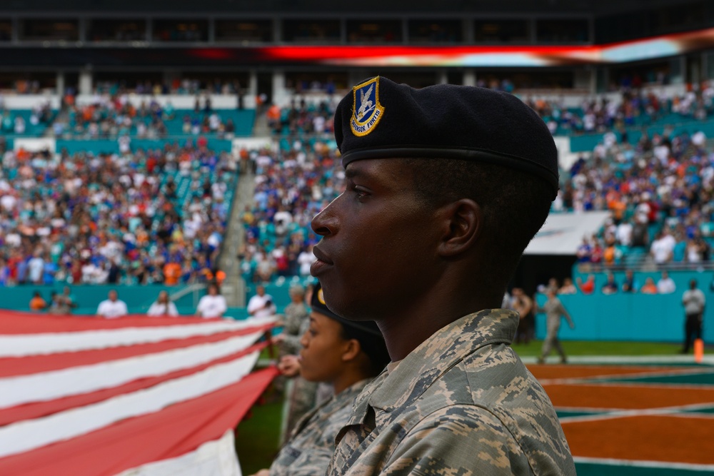 45th SW Airmen unfurl flag at Miami Dolphins game