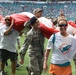 45th SW Airmen unfurl flag at Miami Dolphins game