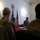 Maryland Guard, Bosnia-Herzegovina armed forces celebrate 15-year partnership A formal military meeting or briefing is taking place in an official room with multiple personnel present. The scene includes both U.S. military personnel in MultiCam/OCP uniforms and at least one foreign military officer, alongside a civilian woman. The presence of the U.S. flag and what appears to be the flag of Bosnia and Herzegovina suggests a bilateral or multinational military engagement.