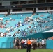 45th SW Airmen unfurl flag at Miami Dolphins game