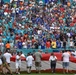 45th SW Airmen unfurl flag at Miami Dolphins game