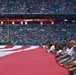 45th SW Airmen unfurl flag at Miami Dolphins game