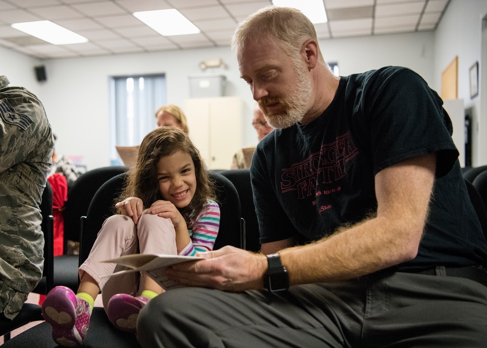 Airmen light candles as a way to remember, symbol of hope
